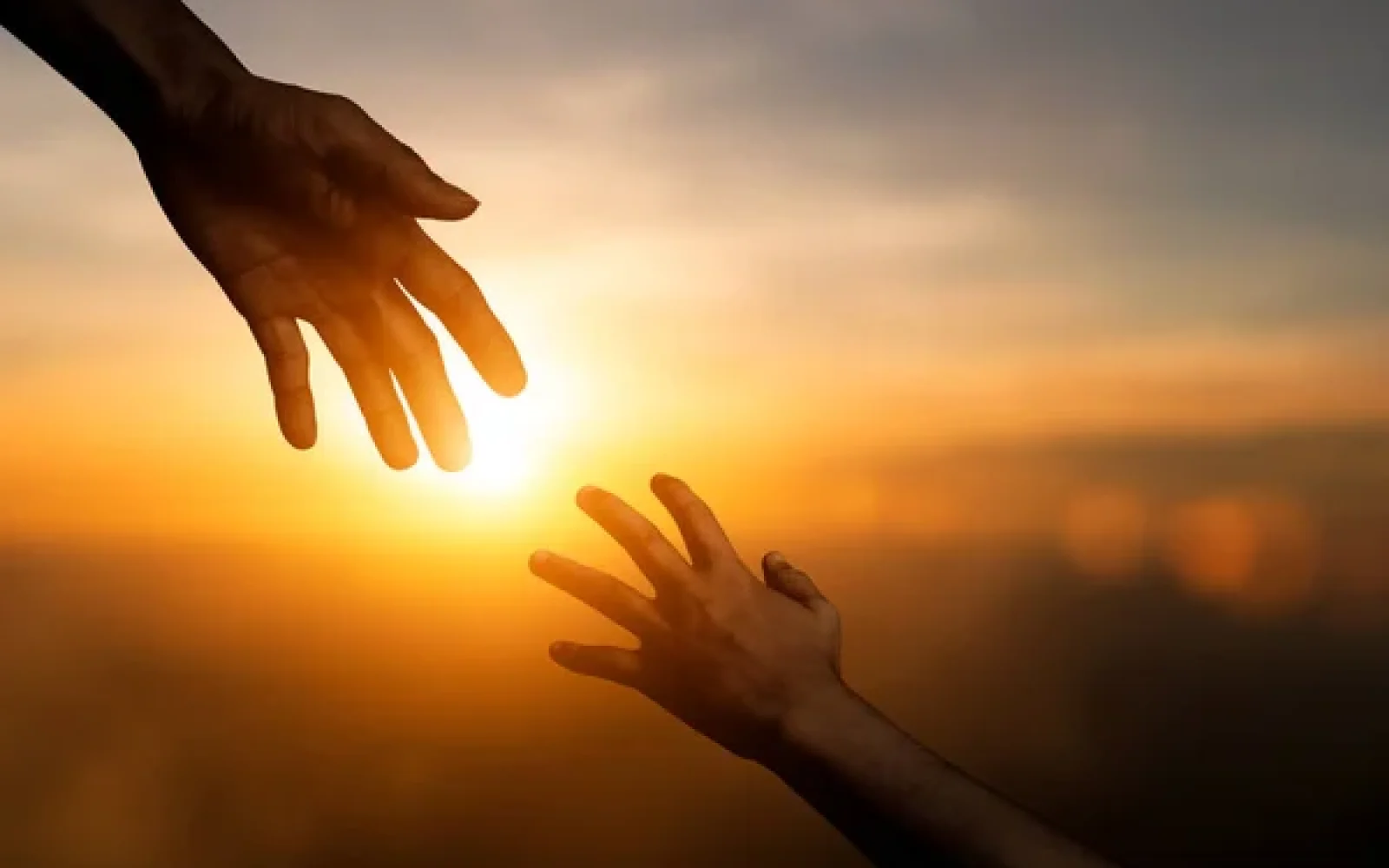 depositphotos_558279524-stock-photo-silhouette-reaching-giving-helping-hand